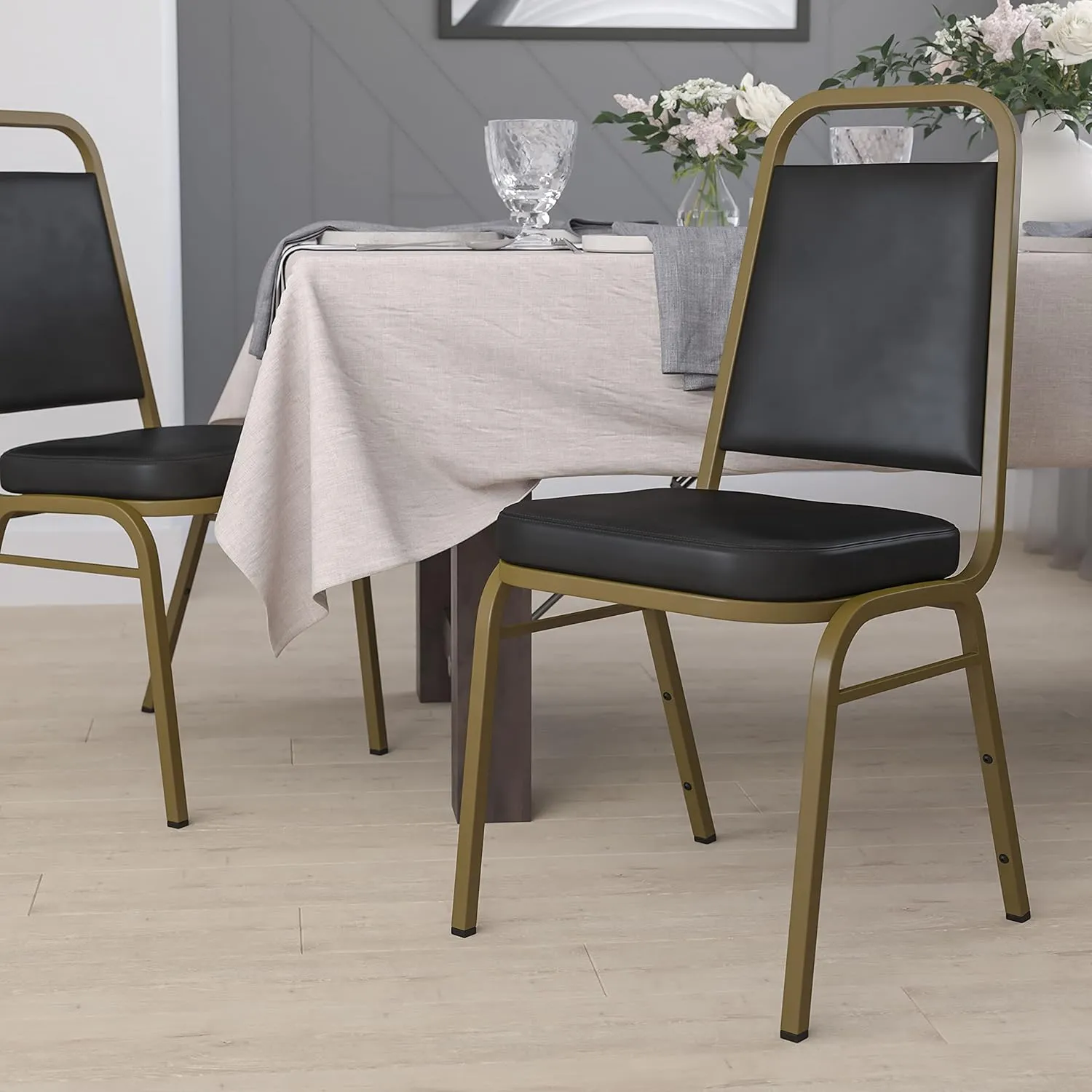 EMMA   OLIVER Trapezoidal Back Stacking Banquet Chair, Black Vinyl/Gold Frame